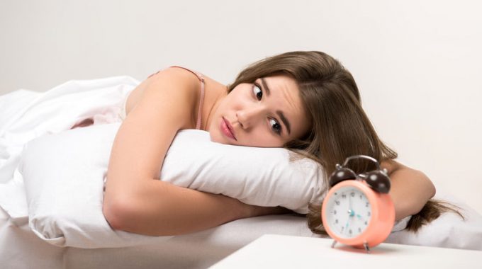 35244939 - Beauty Lying On The Bed With A Clock